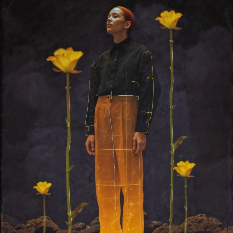 surrounded by tall flowers